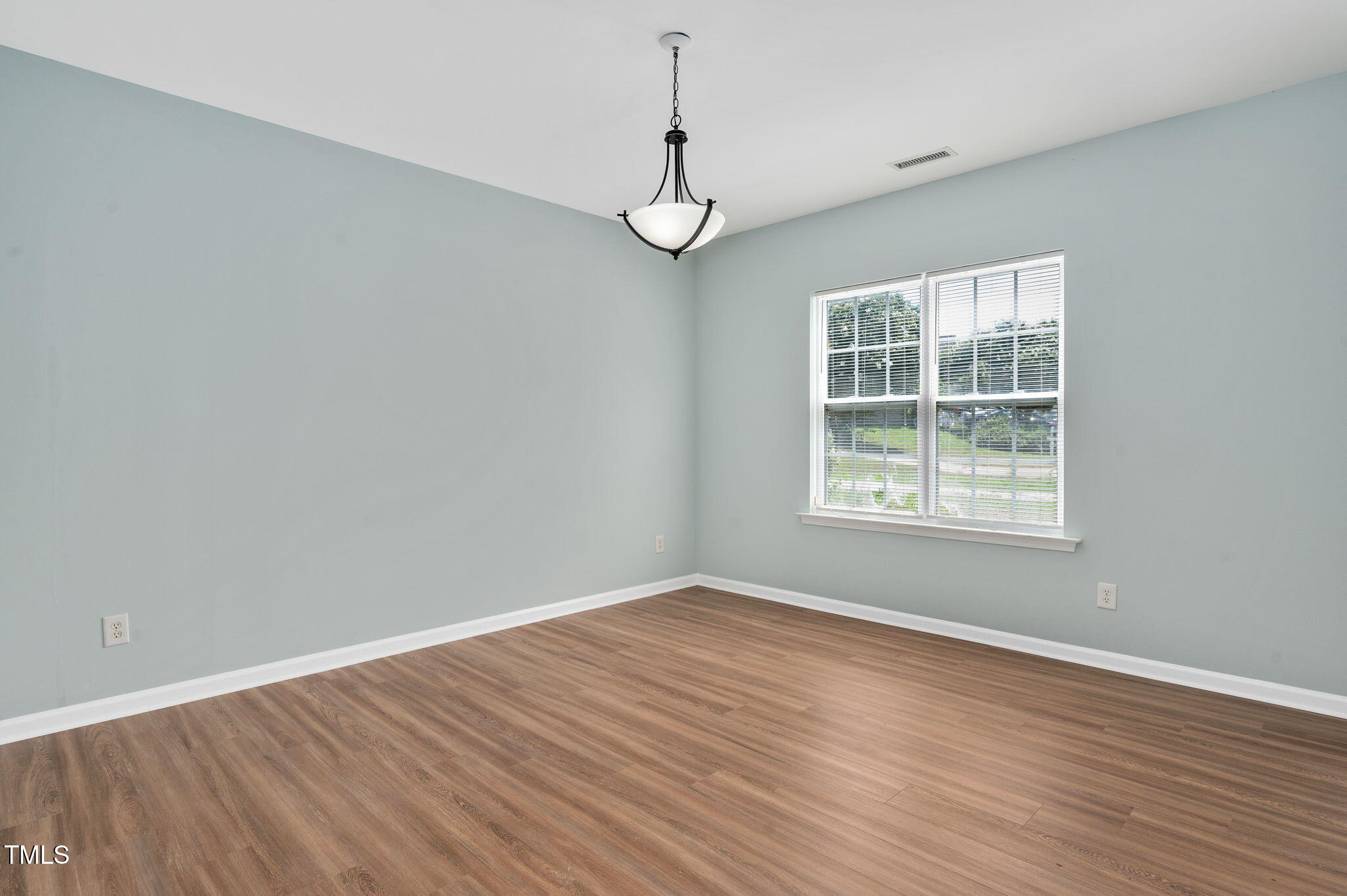3805 Mike Levi Court Raleigh, NC 27610 - Photo 12 of 34 wooden floor in an empty room with a window