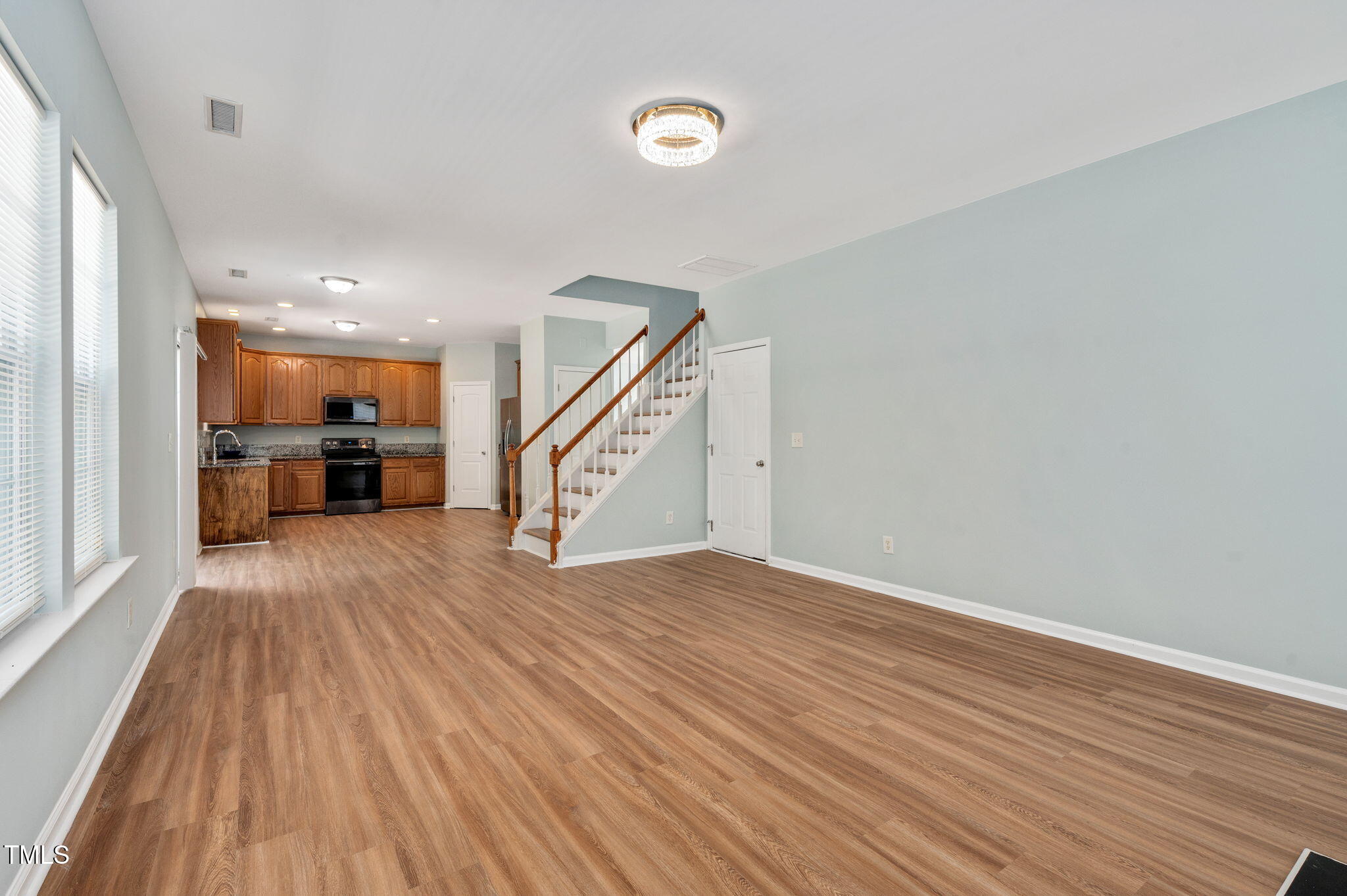3805 Mike Levi Court Raleigh, NC 27610 - Photo 20 of 34 wooden floor in an empty room with a window