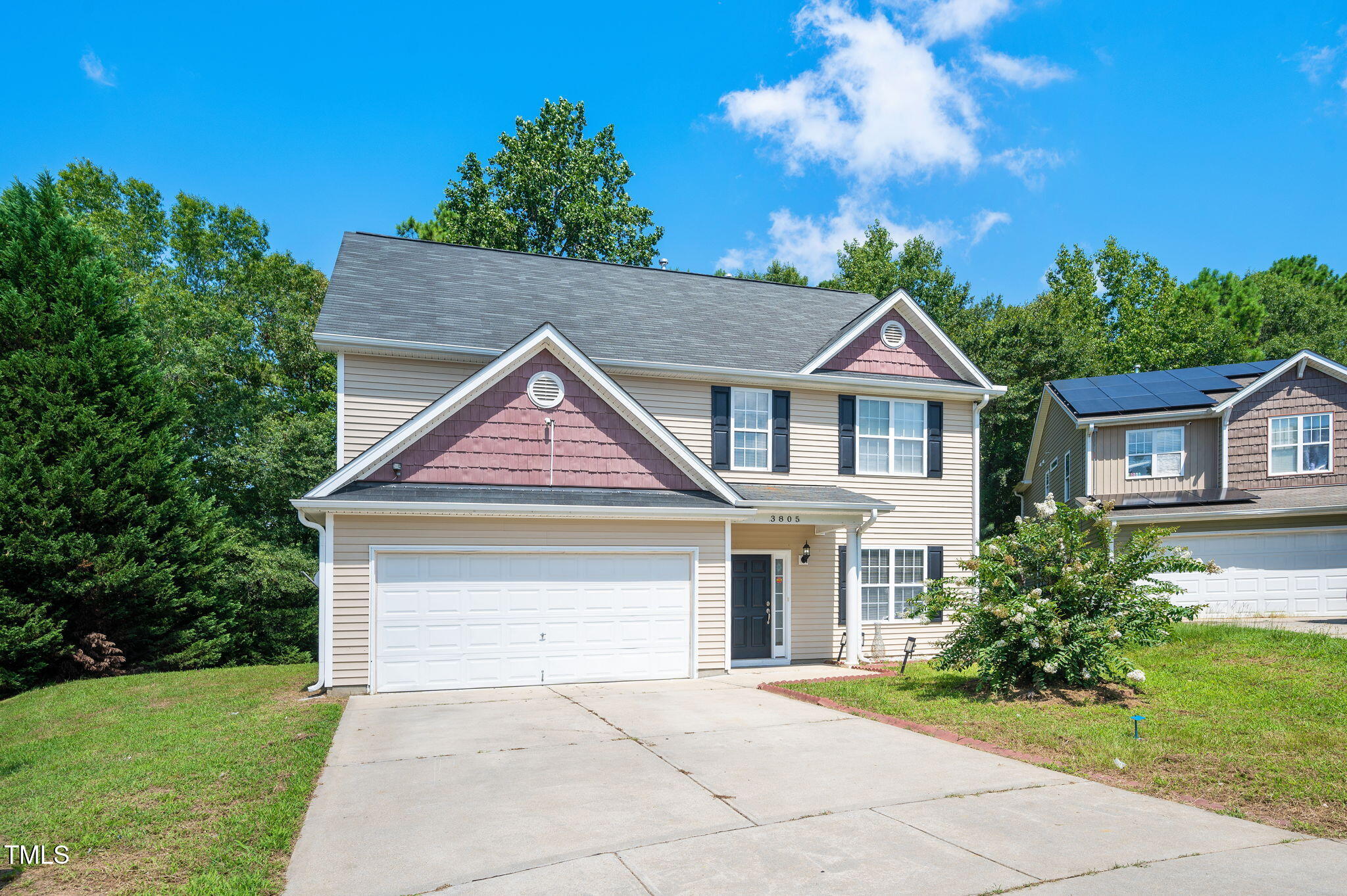 3805 Mike Levi Court Raleigh, NC 27610 - Photo 2 of 34 a front view of a house with a garden and yard