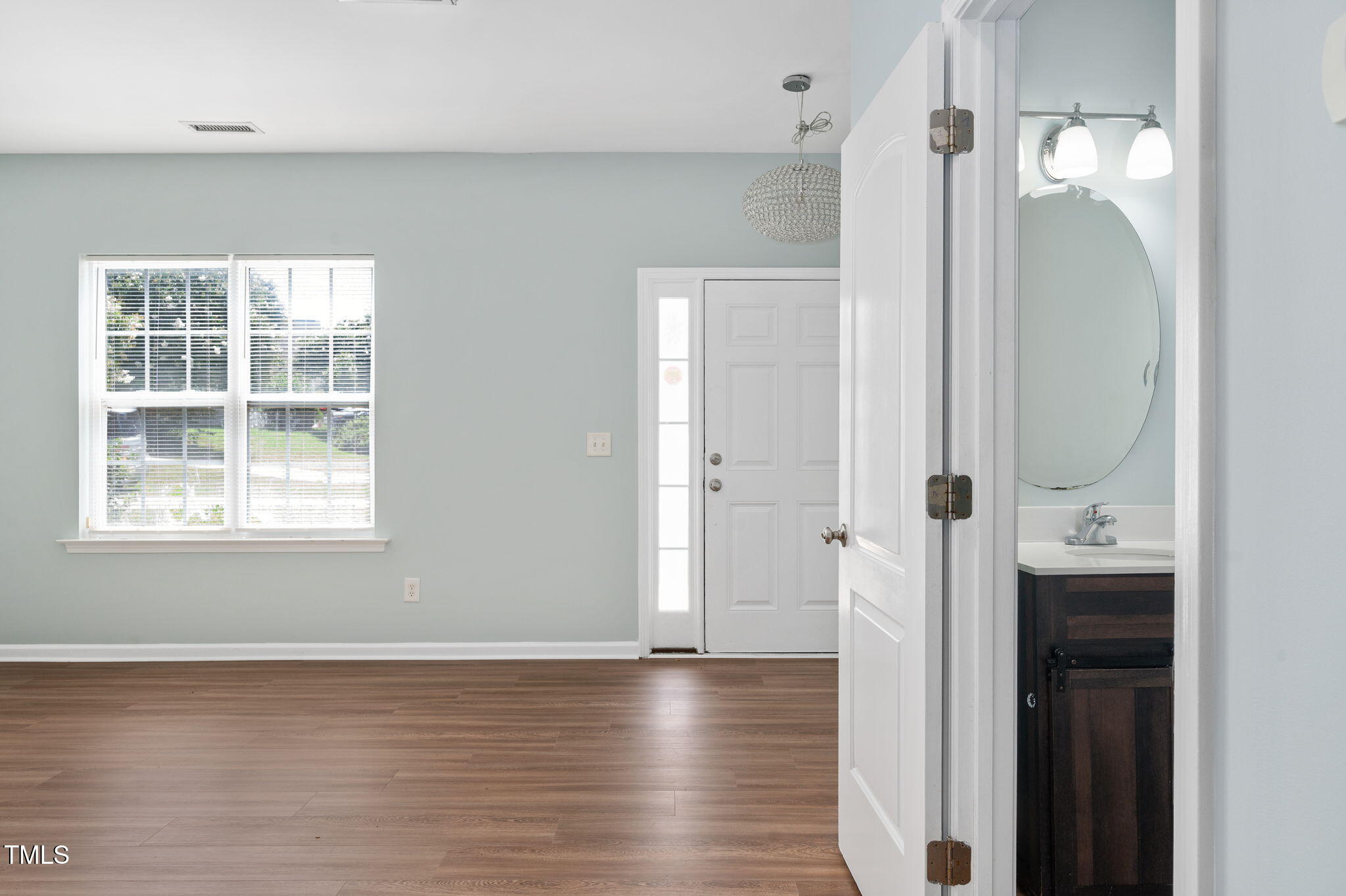 3805 Mike Levi Court Raleigh, NC 27610 - Photo 21 of 34 an empty room with wooden floor and a window