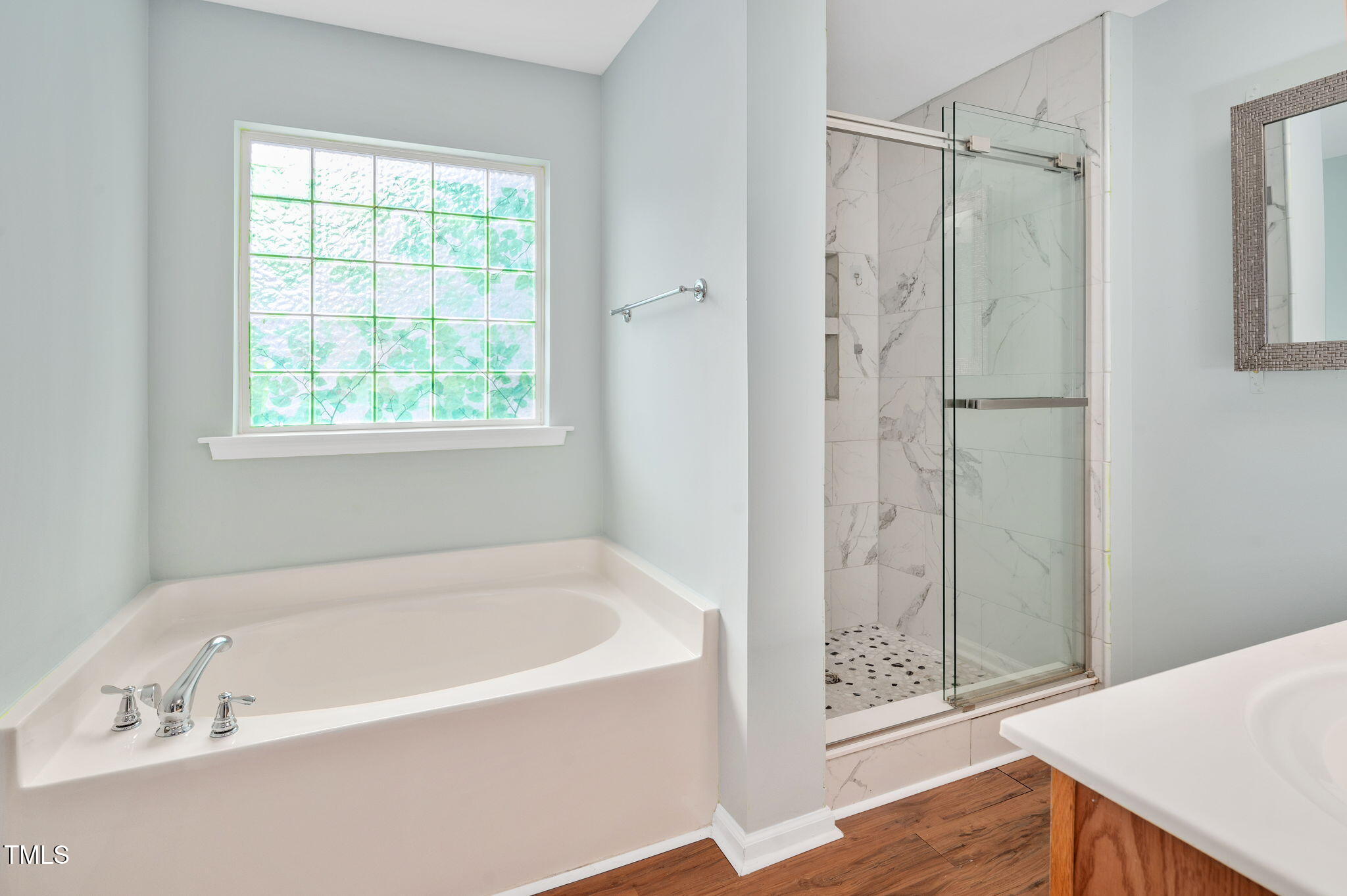 3805 Mike Levi Court Raleigh, NC 27610 - Photo 25 of 34 a white bath tub sitting next to a shower
