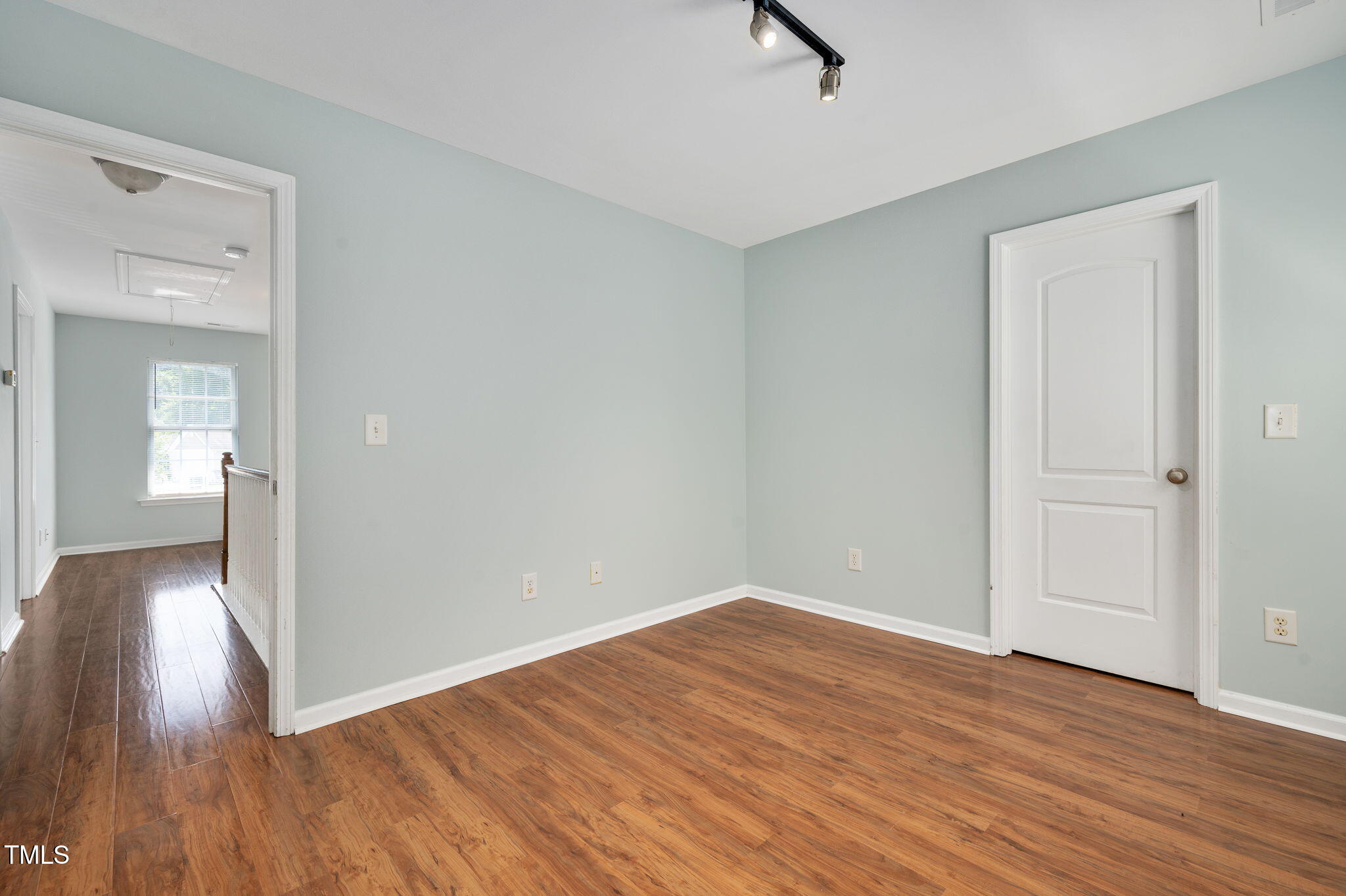 3805 Mike Levi Court Raleigh, NC 27610 - Photo 26 of 34 wooden floor in an empty room with a window