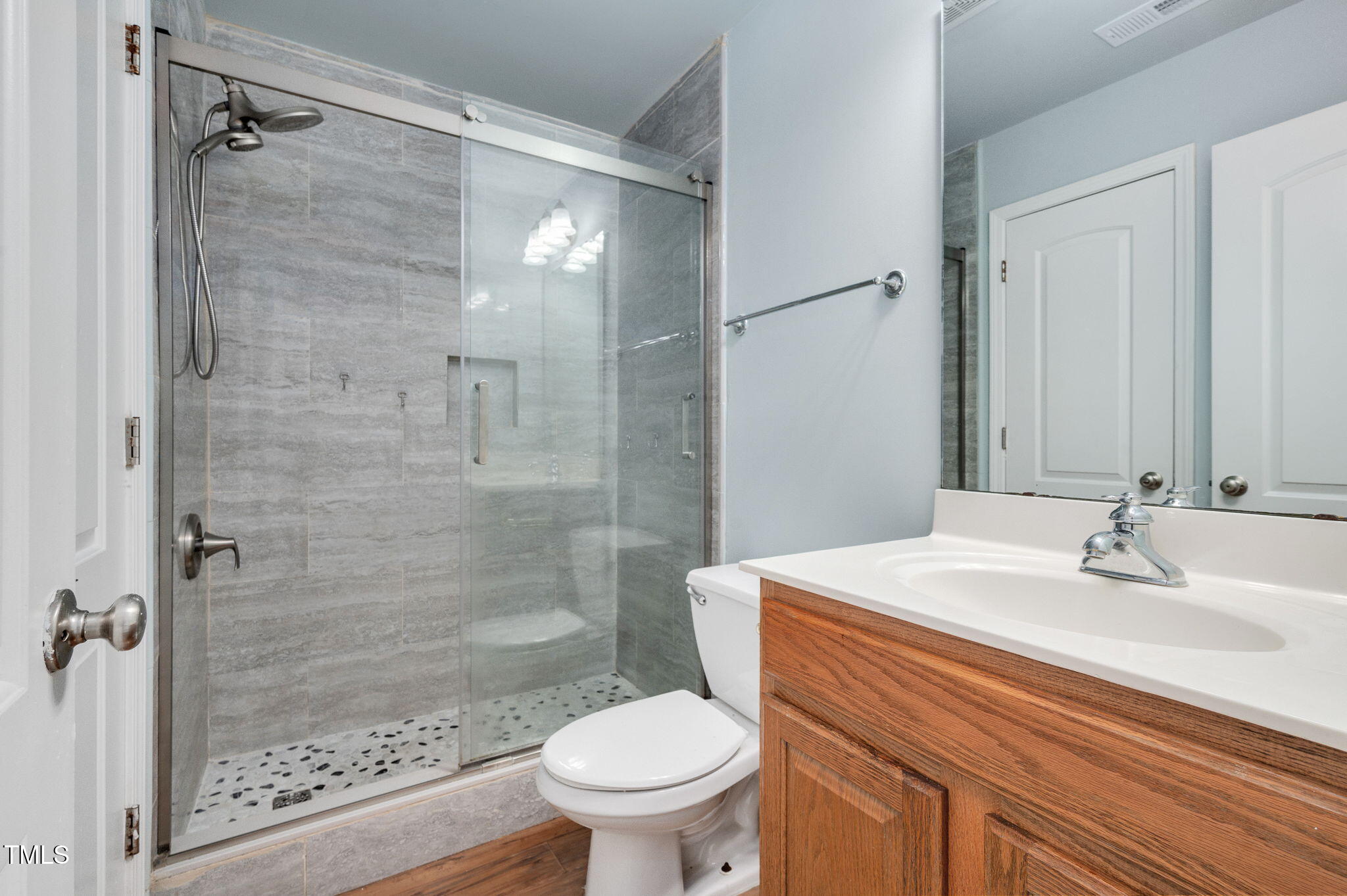 3805 Mike Levi Court Raleigh, NC 27610 - Photo 31 of 34 a bathroom with a sink toilet and shower