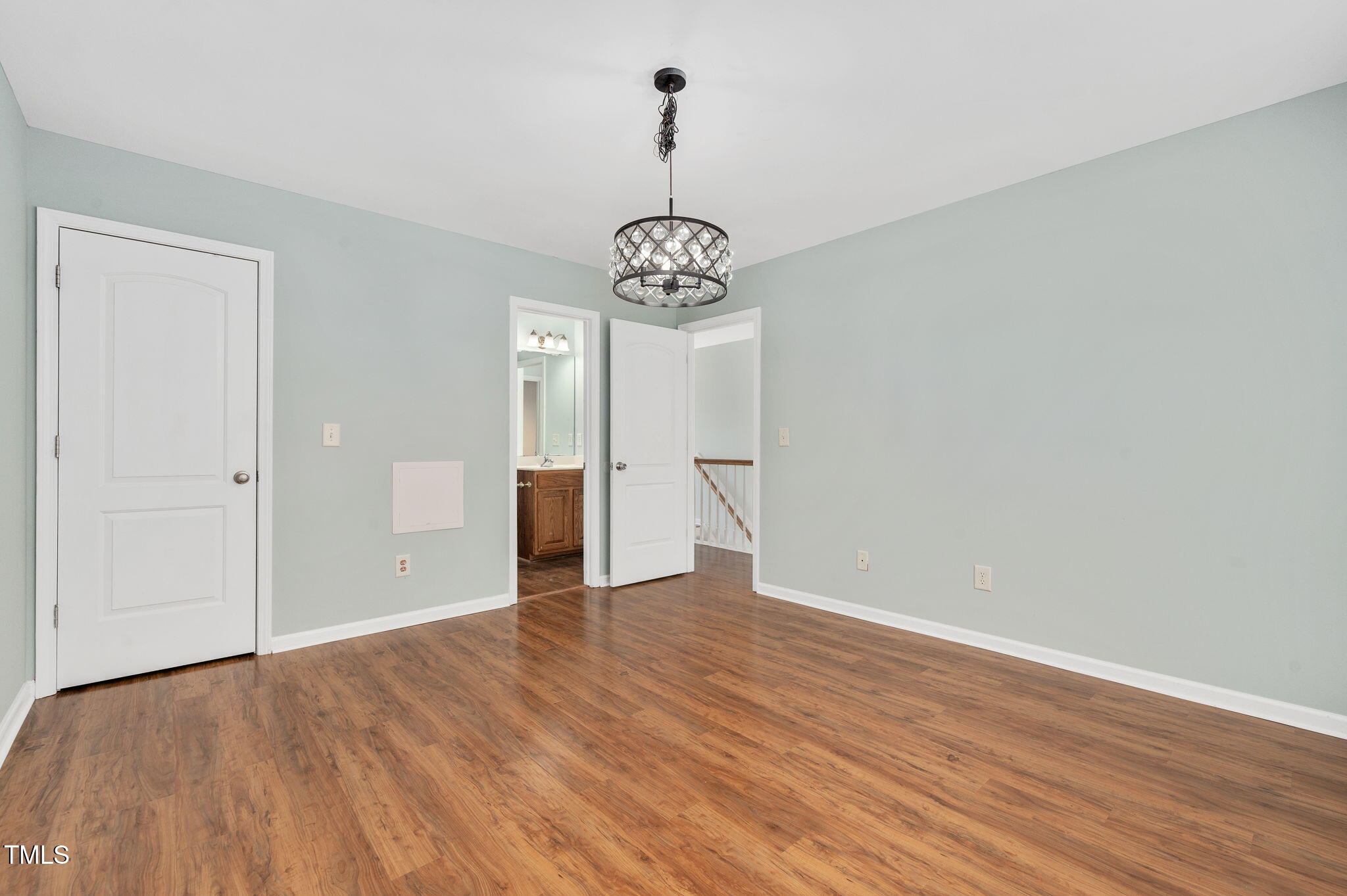 3805 Mike Levi Court Raleigh, NC 27610 - Photo 33 of 34 a view of an empty room with wooden floor and a window
