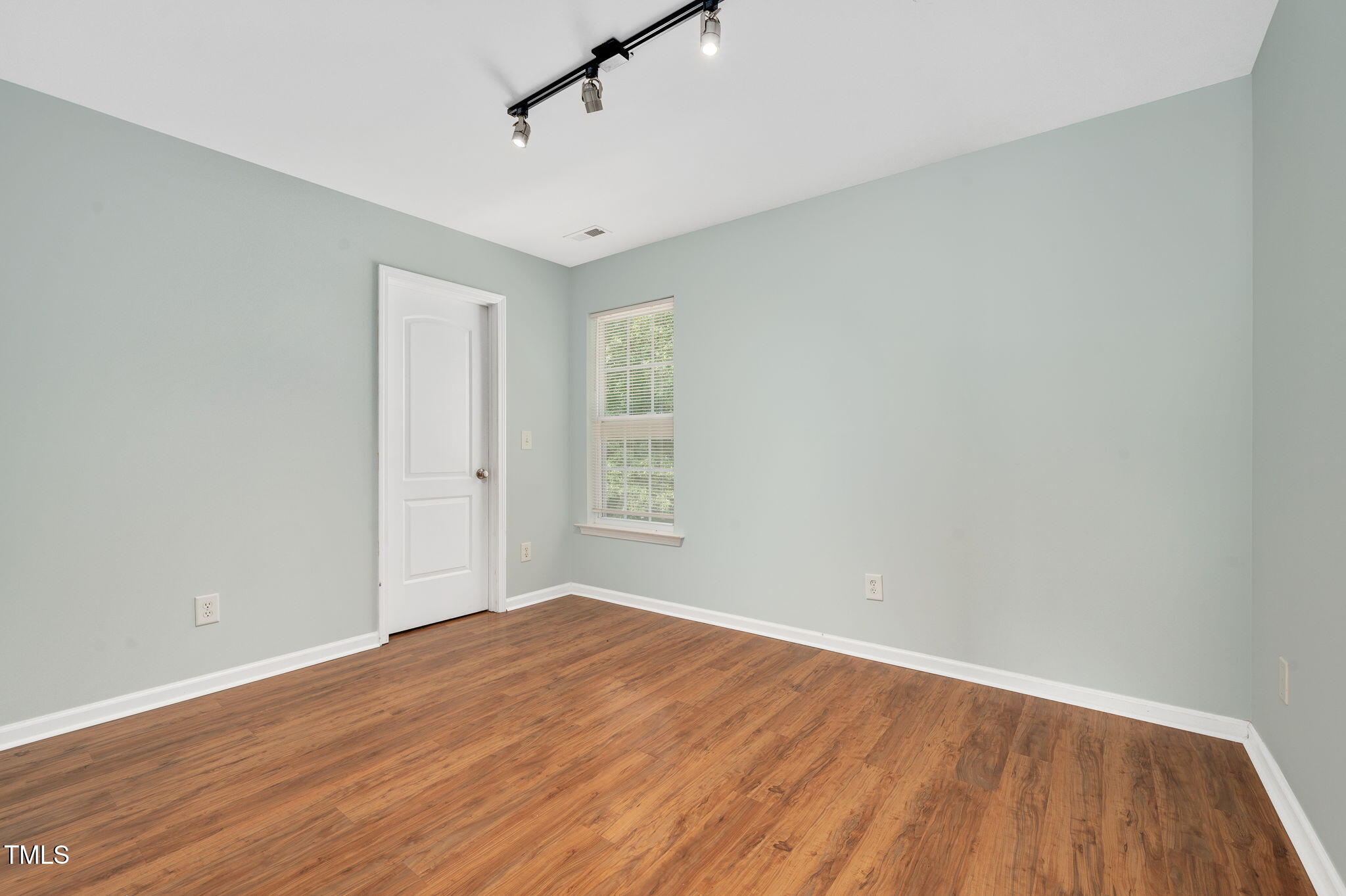 3805 Mike Levi Court Raleigh, NC 27610 - Photo 34 of 34 a view of empty room with wooden floor and fan