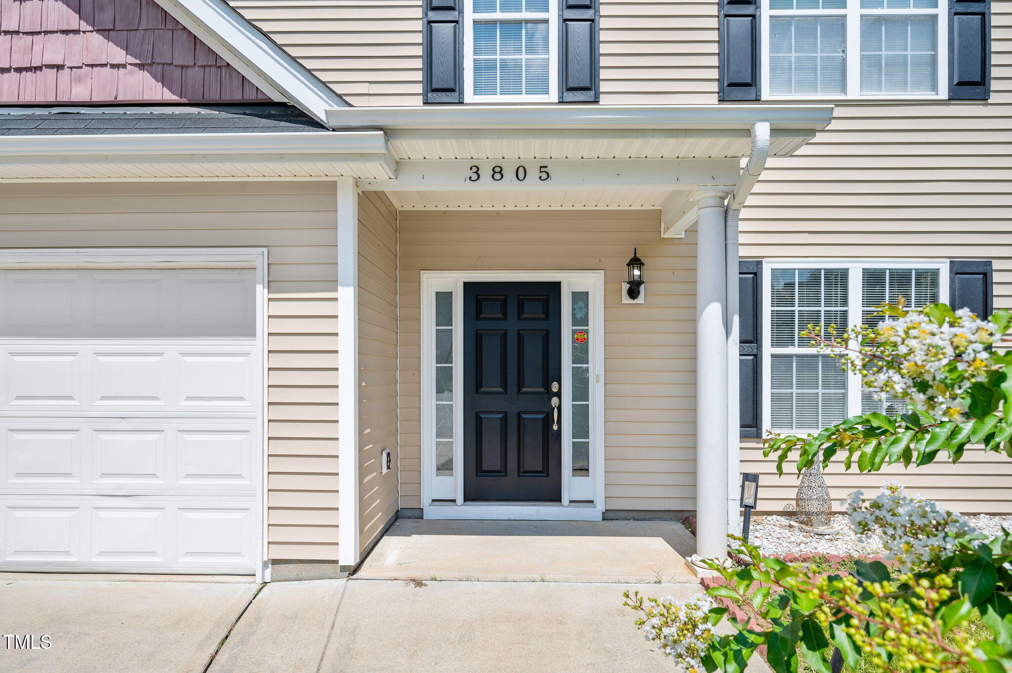 3805 Mike Levi Court Raleigh, NC 27610 - Photo 4 of 34 a front view of a house with a garden