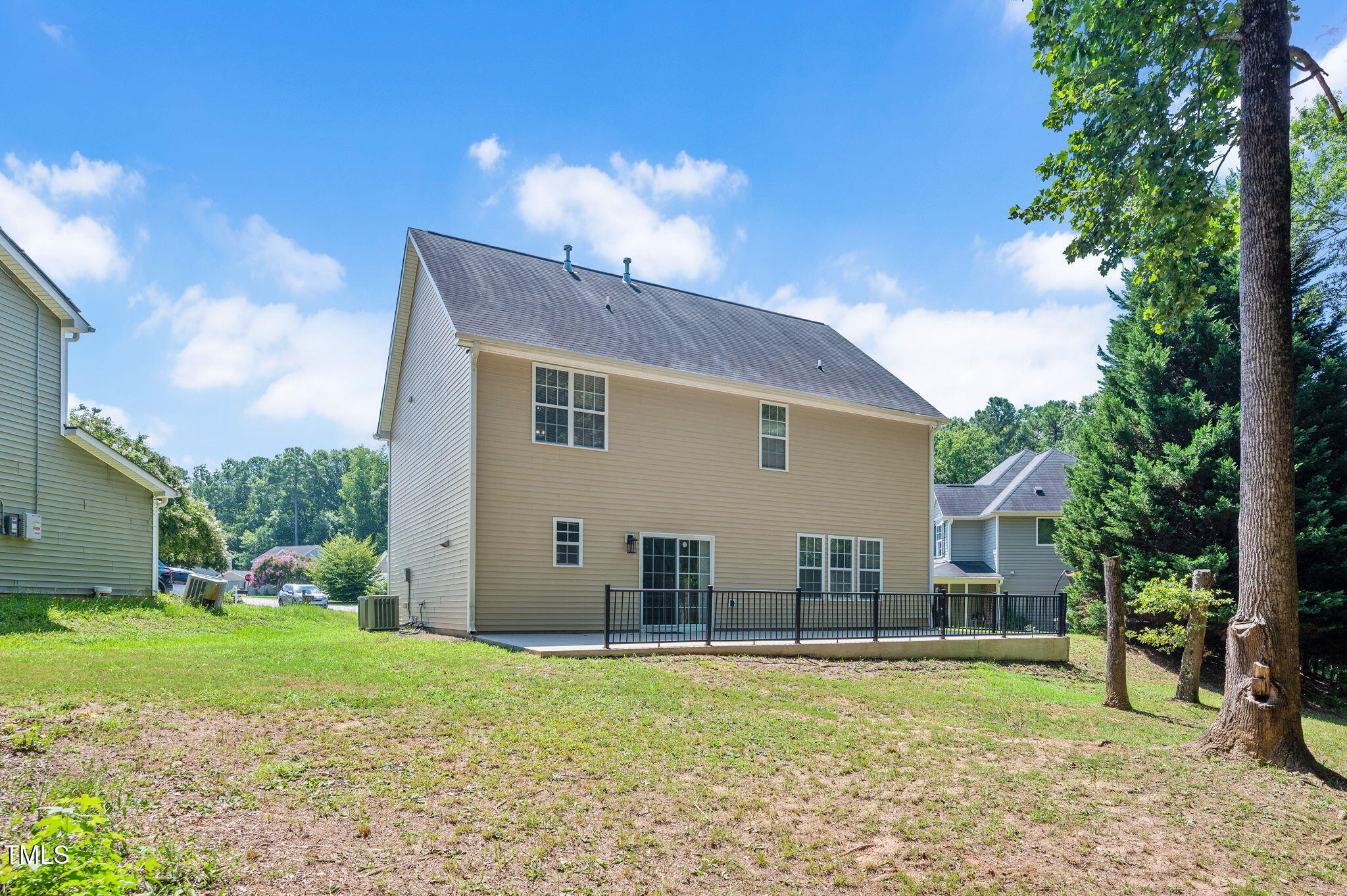 3805 Mike Levi Court Raleigh, NC 27610 - Photo 7 of 34 a view of a house with backyard and a tree