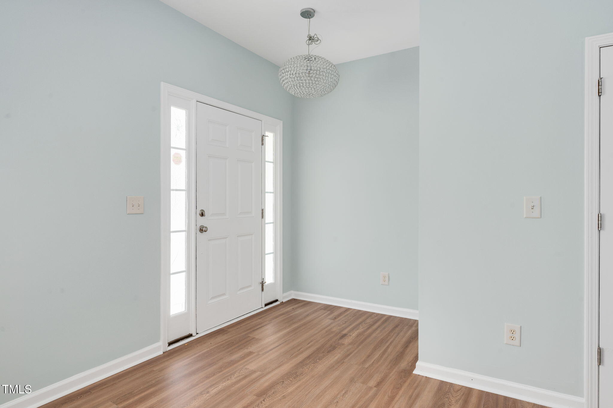 3805 Mike Levi Court Raleigh, NC 27610 - Photo 9 of 34 a view of an empty room with wooden floor