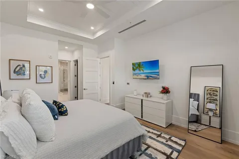 a bedroom with a bed and a cabinets