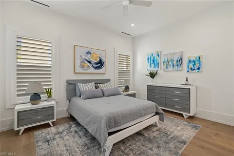 a bedroom with a bed and a dresser