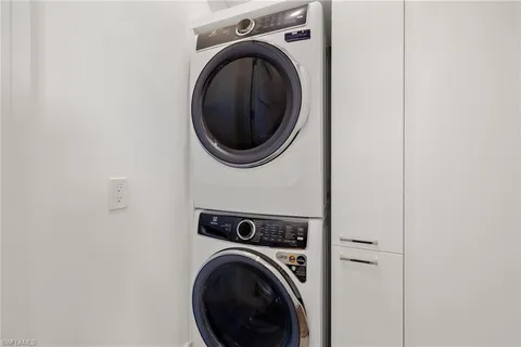 a view of a hallway with washer and dryer
