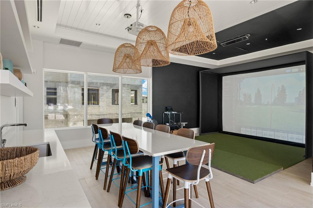 201 8th Street South, Unit 104 Naples, FL 34102 - Photo 27 of 40 a view of a dining room with furniture and chandelier