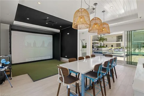a view of a dining room with furniture and chandelier