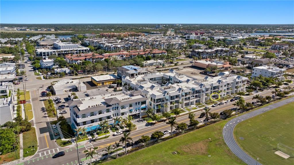 201 8th Street South, Unit 104 Naples, FL 34102 - Photo 40 of 40 an aerial view of residential houses with outdoor space