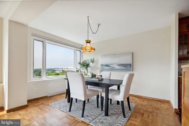 a view of a dining room with furniture window and outside view