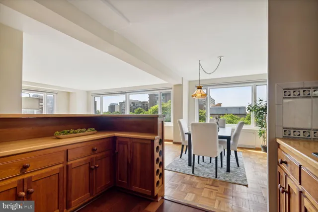 a bedroom with a bed and a potted plant