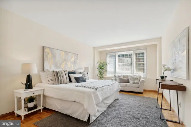 a bedroom with a large bed and a couch