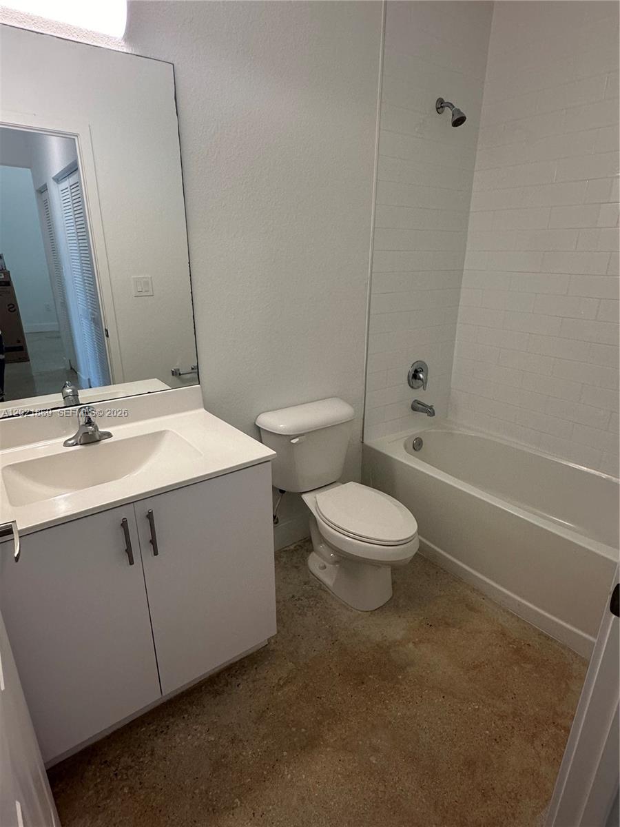 23935 Southwest 110th Court, Unit 23935 Homestead, FL 33032 - Photo 10 of 10 a bathroom with a sink a toilet and shower
