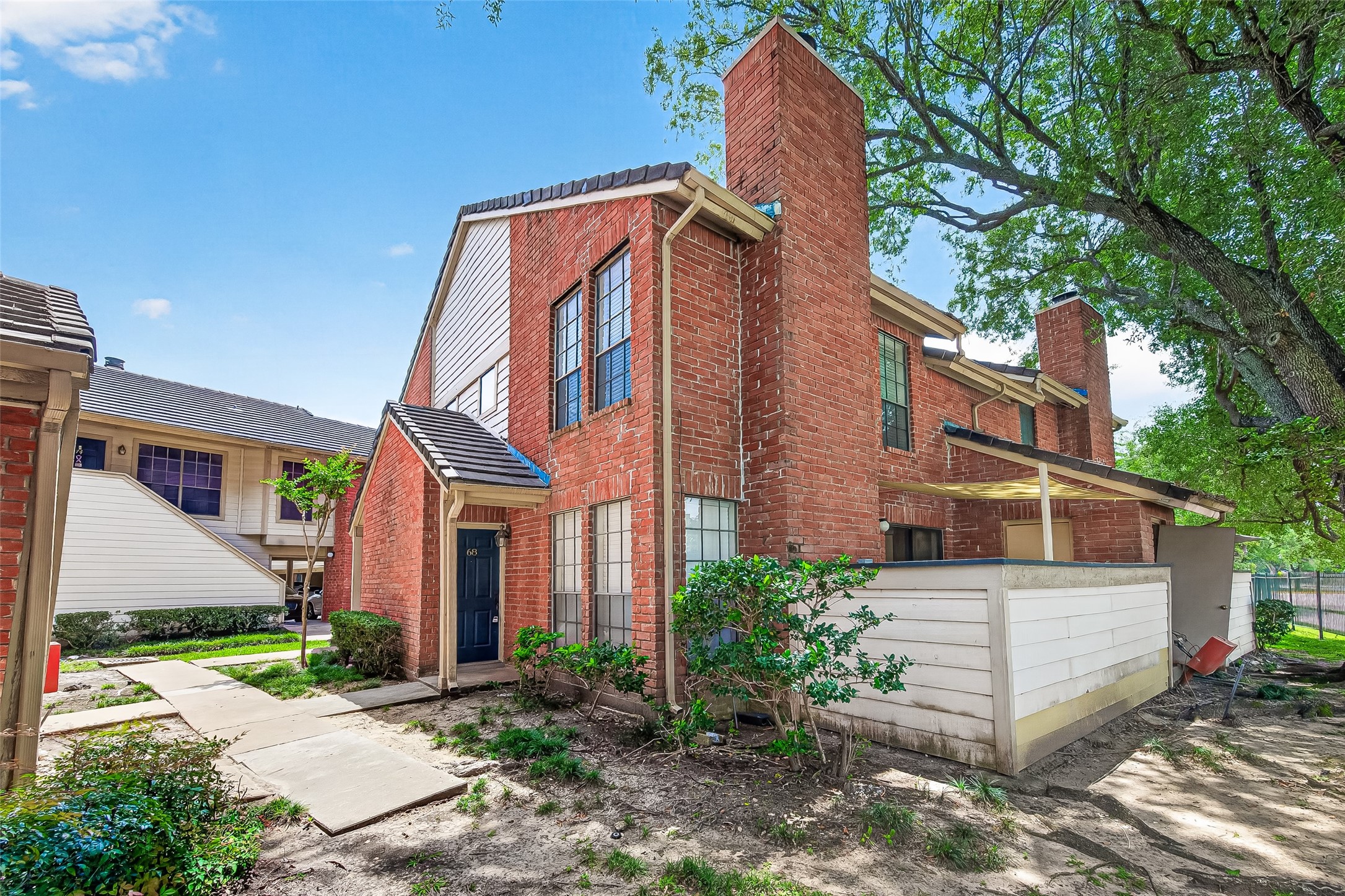2211 South Kirkwood Road, Unit 68 Houston, TX 77077 - Photo 1 of 14 Charming two-story townhome featuring classic brick exterior and a private, enclosed patio for added outdoor living. This well-maintained home offers a functional layout with spacious living and dining areas, updated finishes, and abundant natural light throughout. The kitchen includes granite countertops, ample cabinetry, and a practical design perfect for everyday living. Upstairs, you’ll find comfortable bedrooms with generous closet space. Enjoy low-maintenance living with a cozy courtyard-style patio