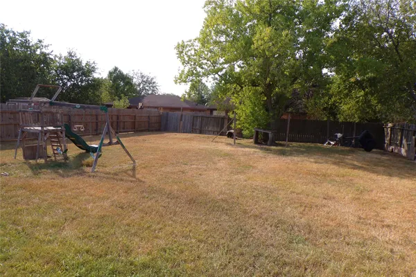 a view of a backyard with a slide