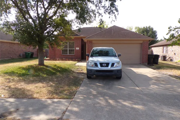 a car parked in front of a house