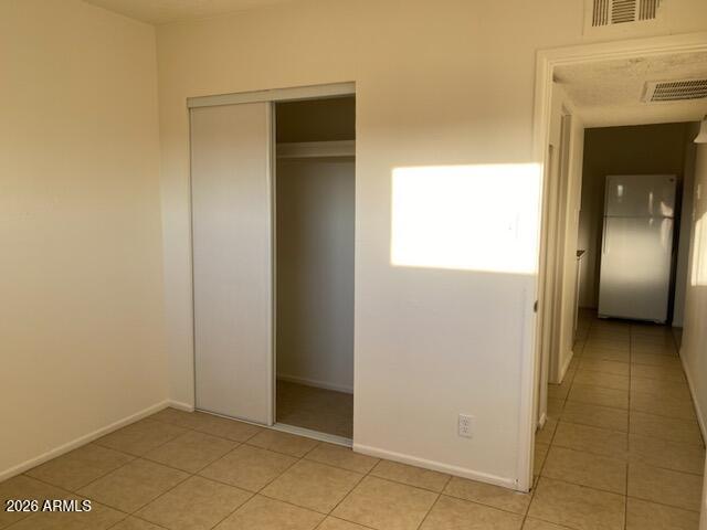 1224 South Smith Road Tempe, AZ 85281 - Photo 10 of 19 a view of a hallway with wooden cabinets