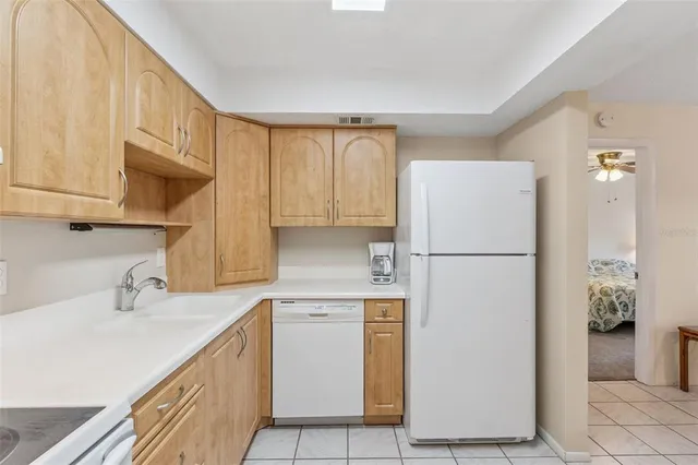 a living room with a couch and a stove top oven