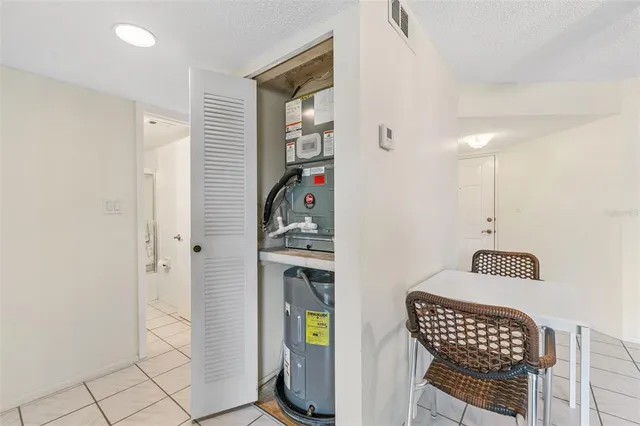 a view of a chairs and table in the balcony