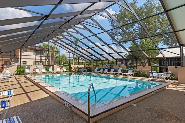 a view of a swimming pool with a patio