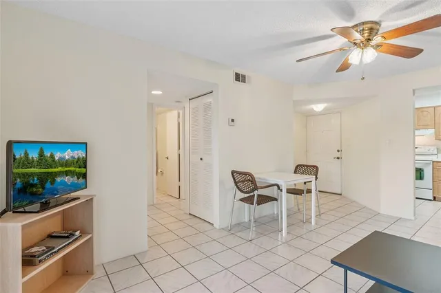 a view of a room with furniture and wooden floor