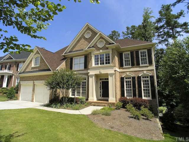 12225 Dunard Street Raleigh, NC 27614 - Photo 1 of 12 a front view of a house with a yard