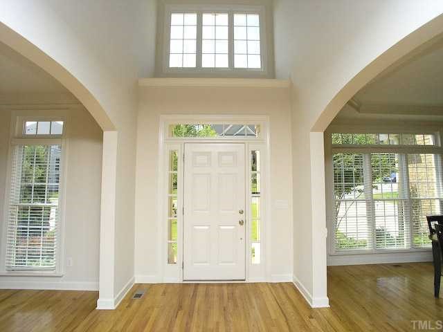 12225 Dunard Street Raleigh, NC 27614 - Photo 2 of 12 an empty room with wooden floor and windows