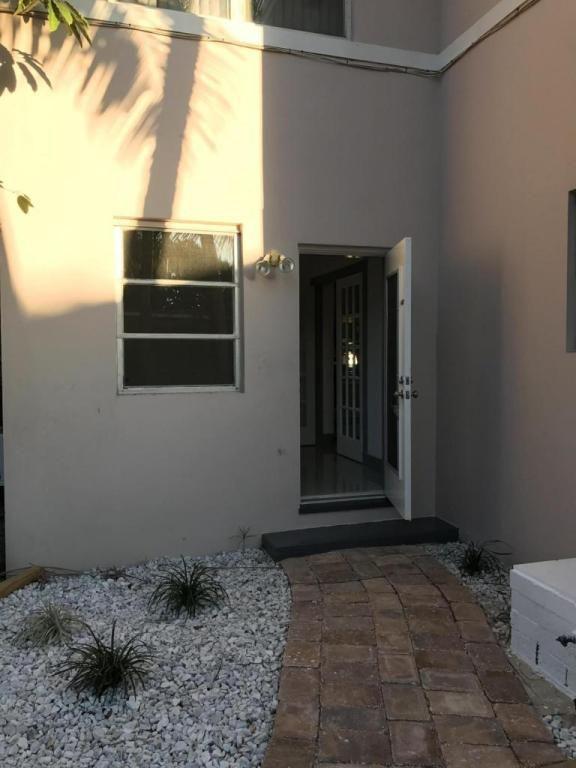 1172 Surf Road, Unit A1 Singer Island, FL 33404 - Photo 8 of 11 back door
