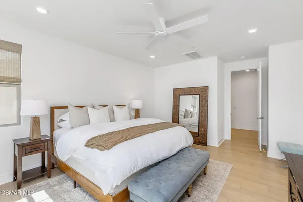 a bedroom with a bed and a view of bathroom