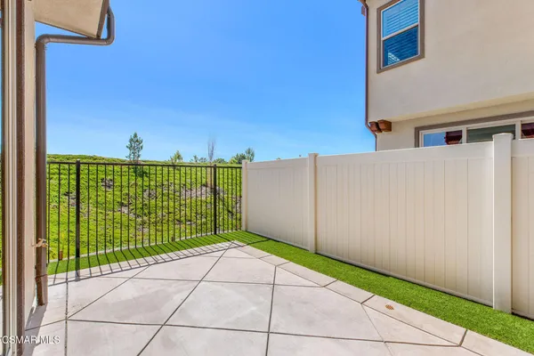 a view of a door and a yard