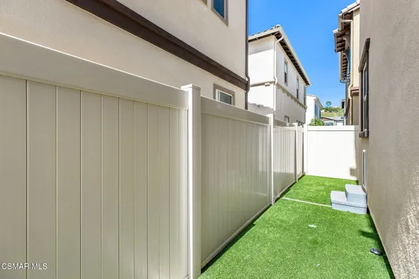 a view of yard from a corridor