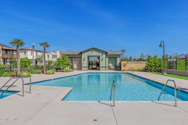 a front view of house with yard and outdoor seating