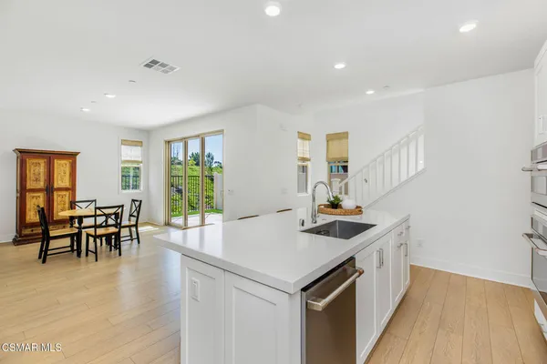a view of a kitchen and dining room