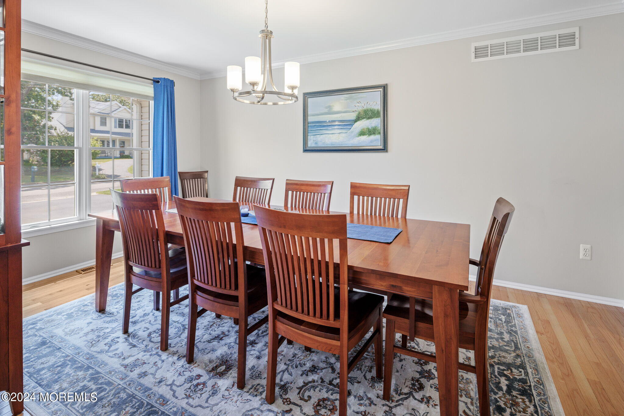152 Seaspray Road Manahawkin, NJ 08050 - Photo 6 of 67 a view of a dining room with furniture a chandelier and wooden floor