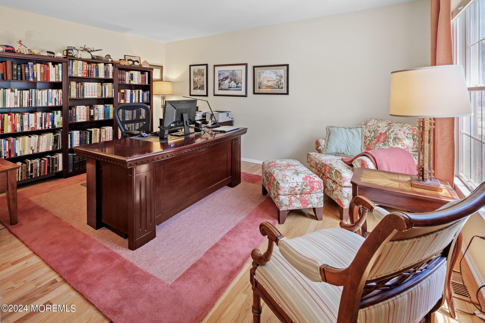 152 Seaspray Road Manahawkin, NJ 08050 - Photo 8 of 67 a living room with furniture and a book shelf