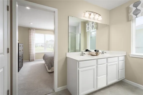a bathroom with a double vanity sink and a mirror