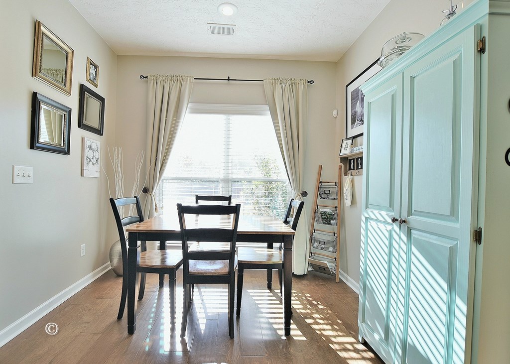 4678 Ivy Patch Drive Fortson, GA 31808 - Photo 10 of 28 a view of a dining room with furniture window and wooden floor