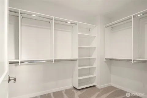 a view of an empty walk in closet