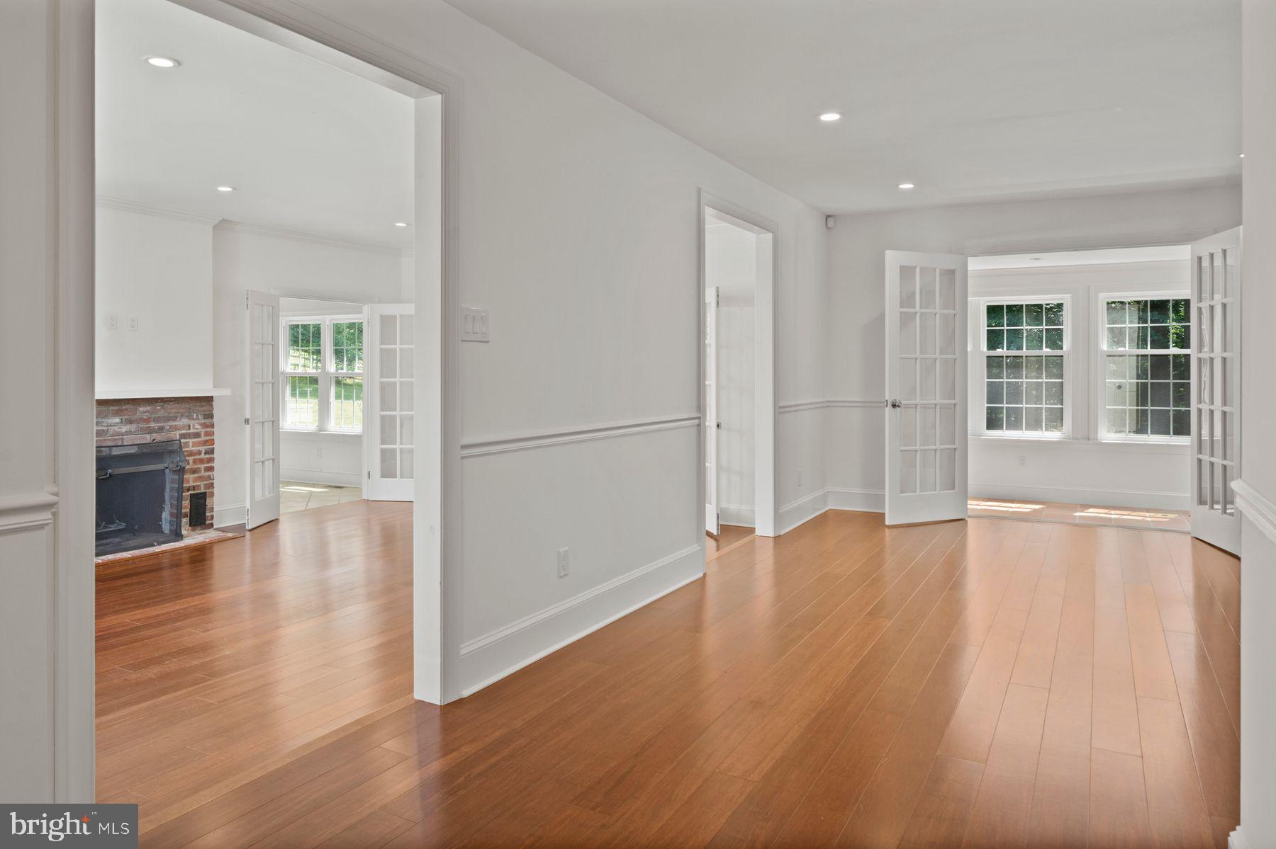 241 Line Road Malvern, PA 19355 - Photo 3 of 33 an empty room with wooden floor and a fireplace