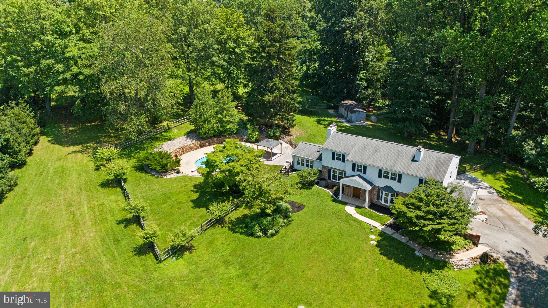 241 Line Road Malvern, PA 19355 - Photo 33 of 33 an aerial view of a house with swimming pool and garden