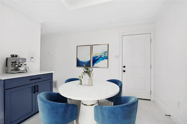 a dining room with furniture and wooden floor