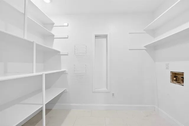 a view of an empty walk in closet