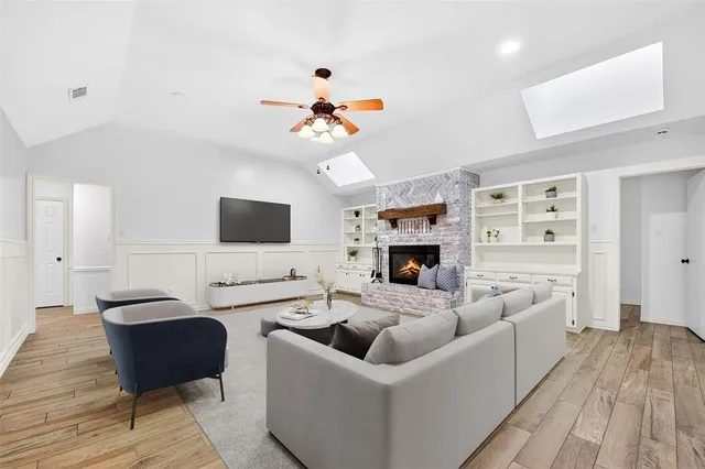 a living room with furniture fireplace and a flat screen tv