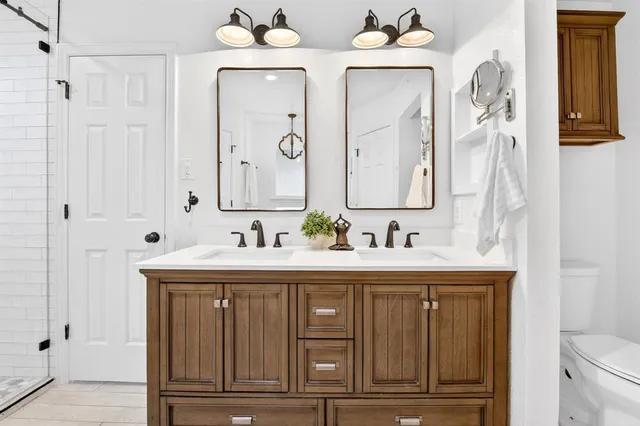 a bathroom with a sink vanity and a mirror