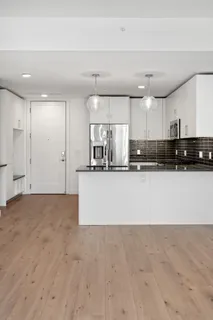 a view of a kitchen with a sink